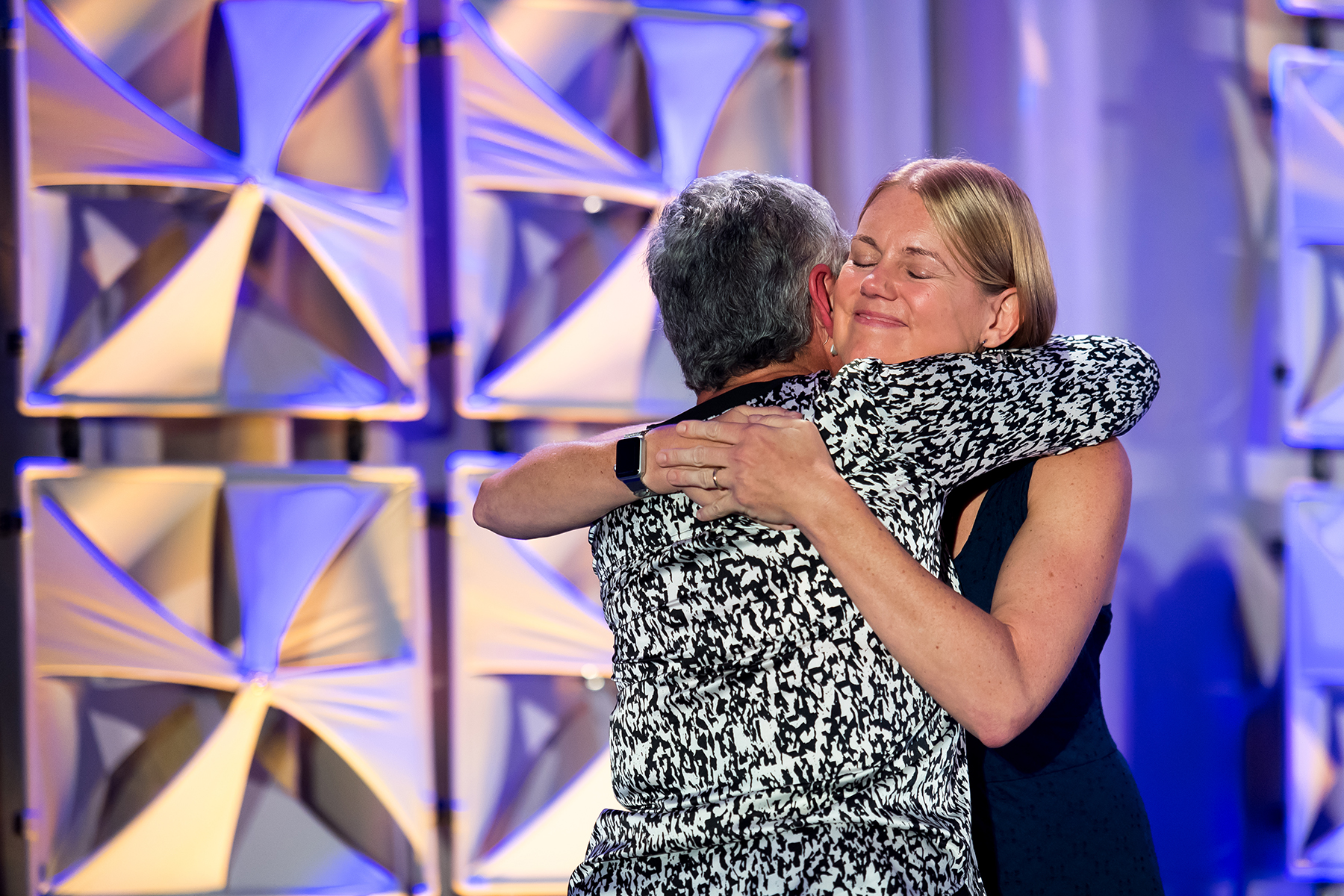 Mandy Jenkins hugs Jane McDonnell on on Sept. 15, 2018, in Austin, Texas, as Mandy presents Jane with the Rich Jaroslovsky Founder Award.