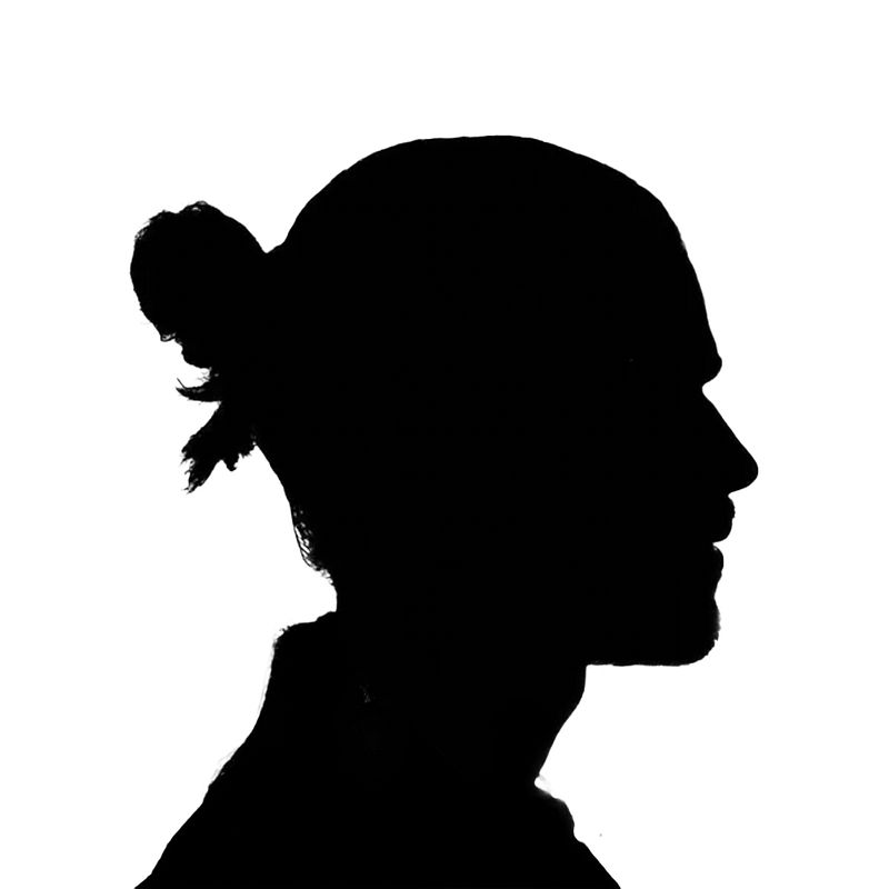 Silhouette profile of a person with hair pulled back in a bun, shown from the side against a white background.